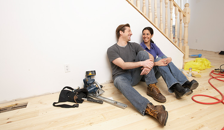 Man and woman doing home improvements