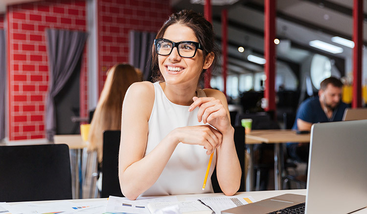 Caucasian Female Business Professional At Laptop