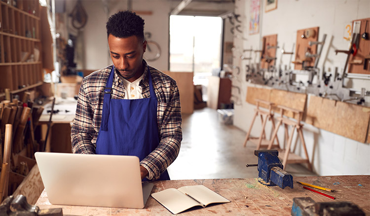 African American Young Man Working In Shop