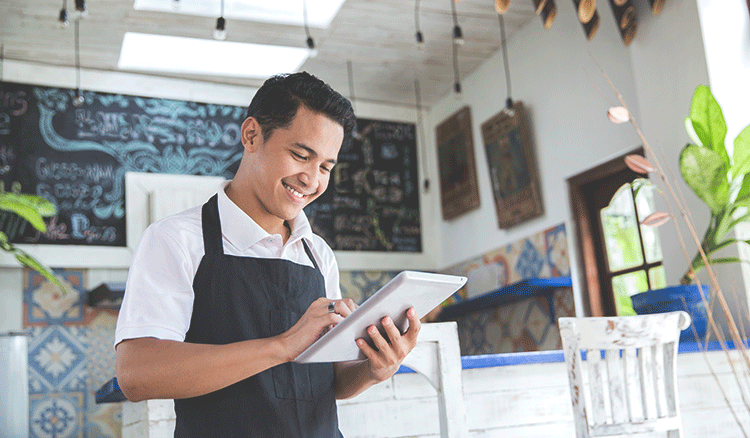 Photo of man on a tablet device